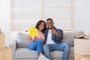 happy boyfriend and girlfriend sitting